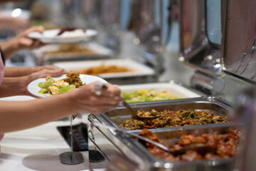 Catering company in Boca Raton serving plated meals at wedding reception